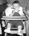 Darcy smoking a cigar at a tender age